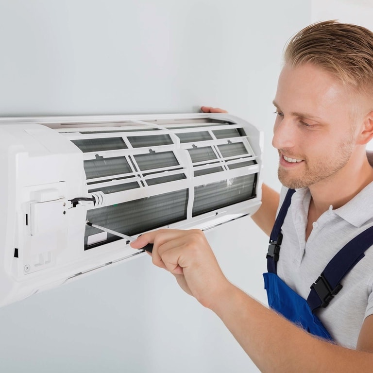 Skilled technician providing professional HVAC maintenance services with Grace Air LLC HVAC Specialists in Lake Worth FL