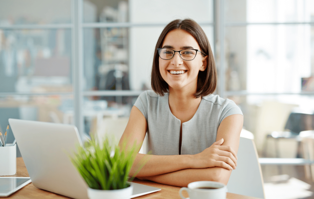 Photo of a woman sitting at a table, relishing the refreshing air conditioning provided by Grace Air LLC, experts in delivering exceptional HVAC solutions for ultimate comfort and satisfaction.